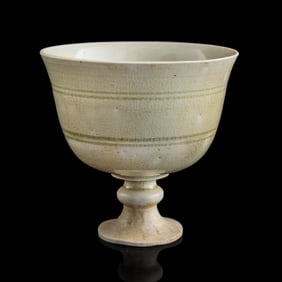 A Chinese celadon-glazed stem cup, Sui dynasty