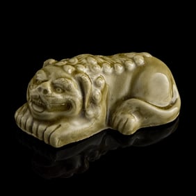 A Chinese celadon lion, Yuan dynasty