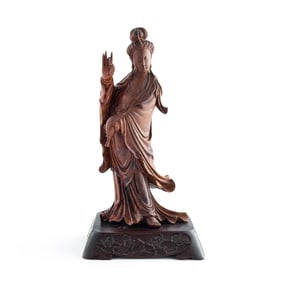 A Chinese carved Longan wood Guanyin, 19th century
