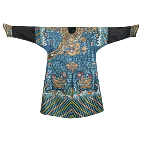 A Chinese blue-ground embroidered dragon robe, early 19th century