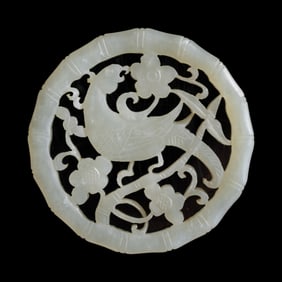 A Chinese openwork white jade parrot pendant, 18th century