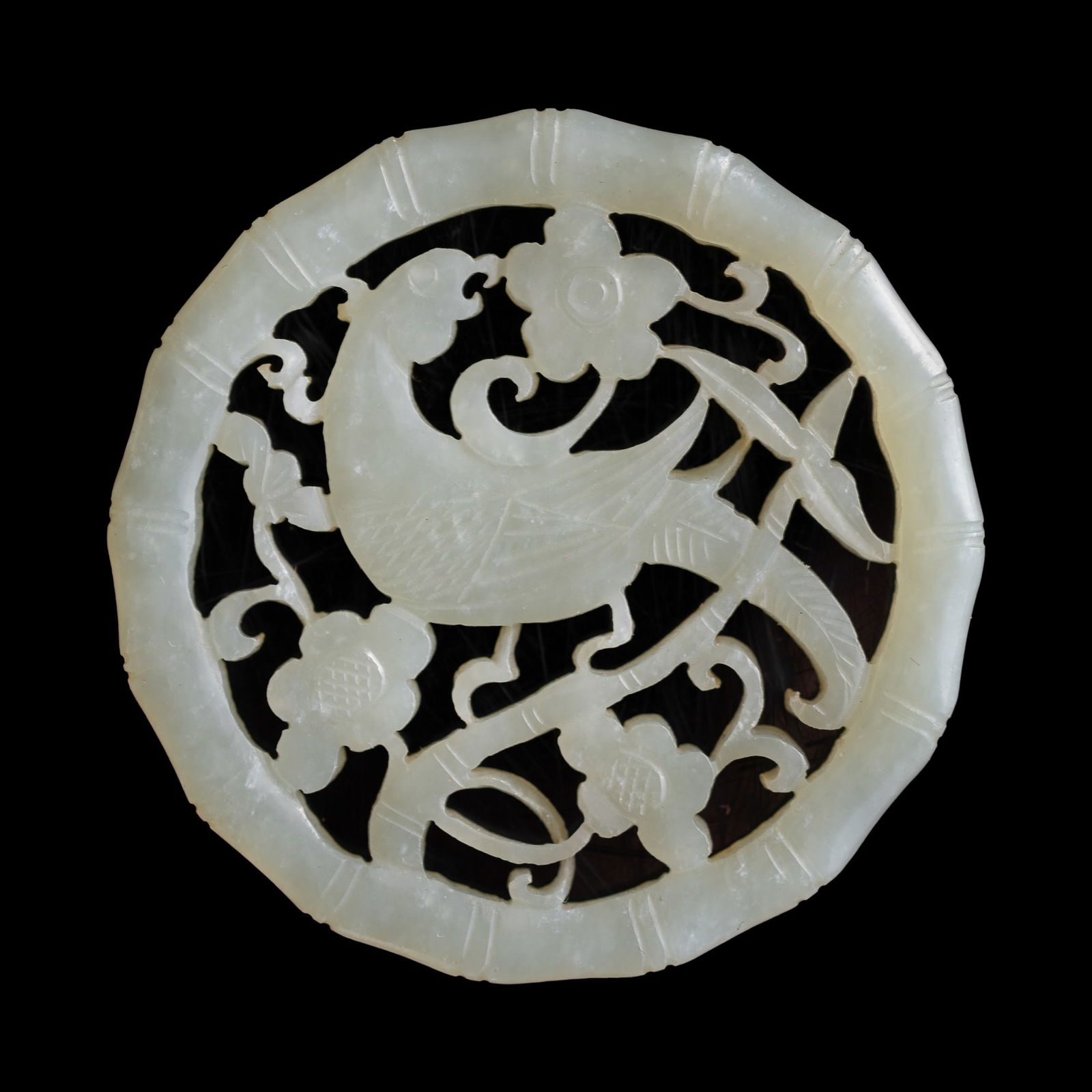 A Chinese openwork white jade parrot pendant, 18th century