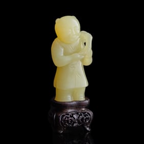 A Chinese yellow jade boy, Qianlong period, Qing dynasty