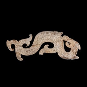 A Chinese jade dragon-shaped plaque, Warring States period