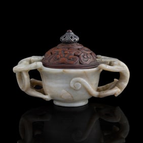 A Chinese chicken-bone white jade cup with chilong handles, Ming dynasty