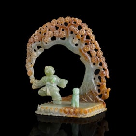 A Chinese carved jadeite pine tree and boy, Republic period