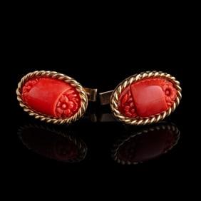 A pair of Chinese carved coral cuff links