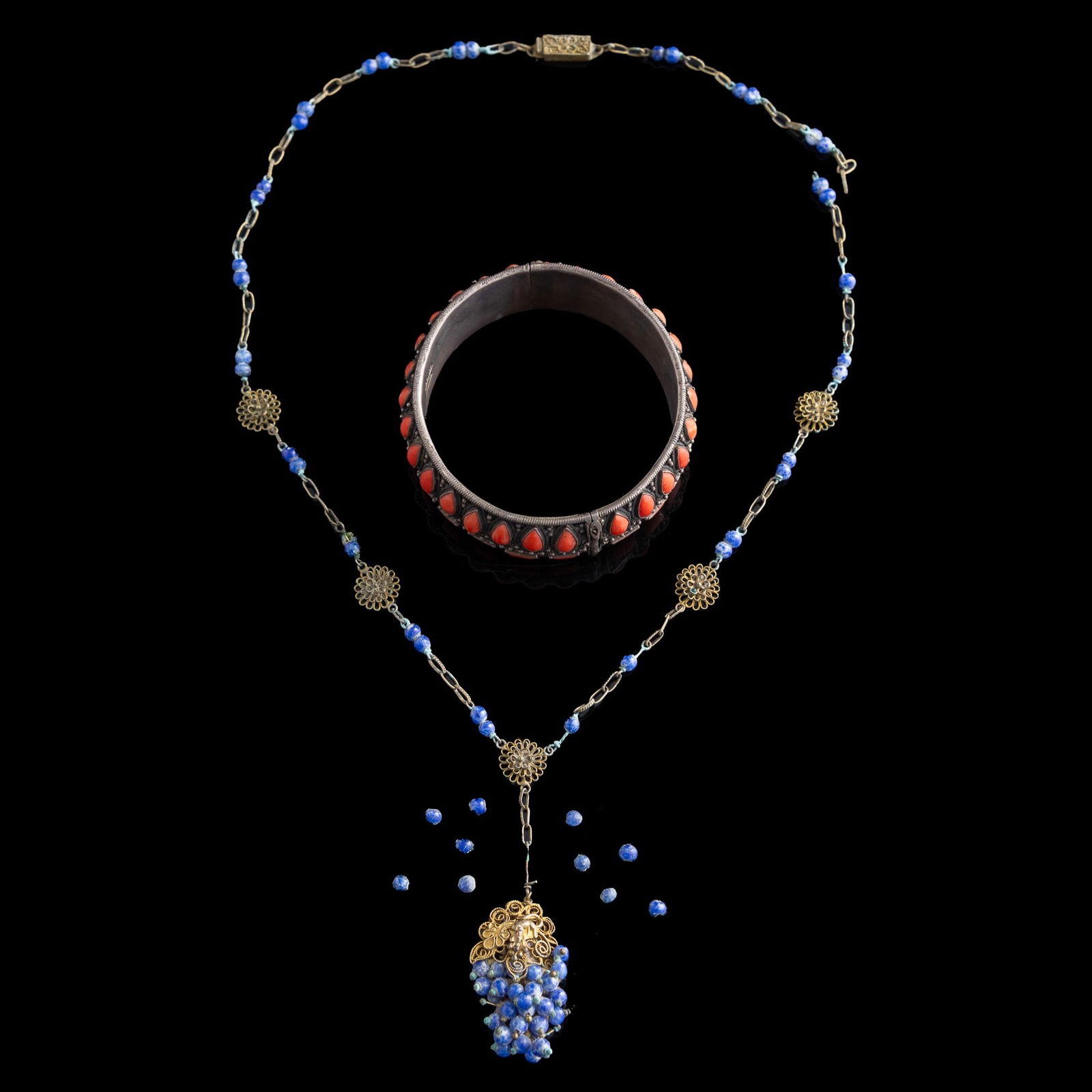 A Chinese coral-inlaid silver bangle and a lapis necklace, Republic period (1 of 9)
