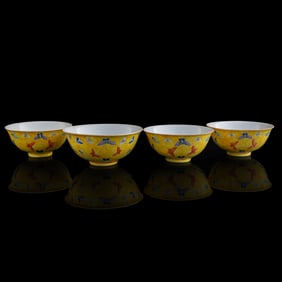 Four Chinese yellow-ground famille rose 'hundred butterflies' bowls, Republic period