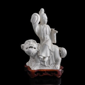 A Chinese Dehua figure of fairy riding lion, 19th century