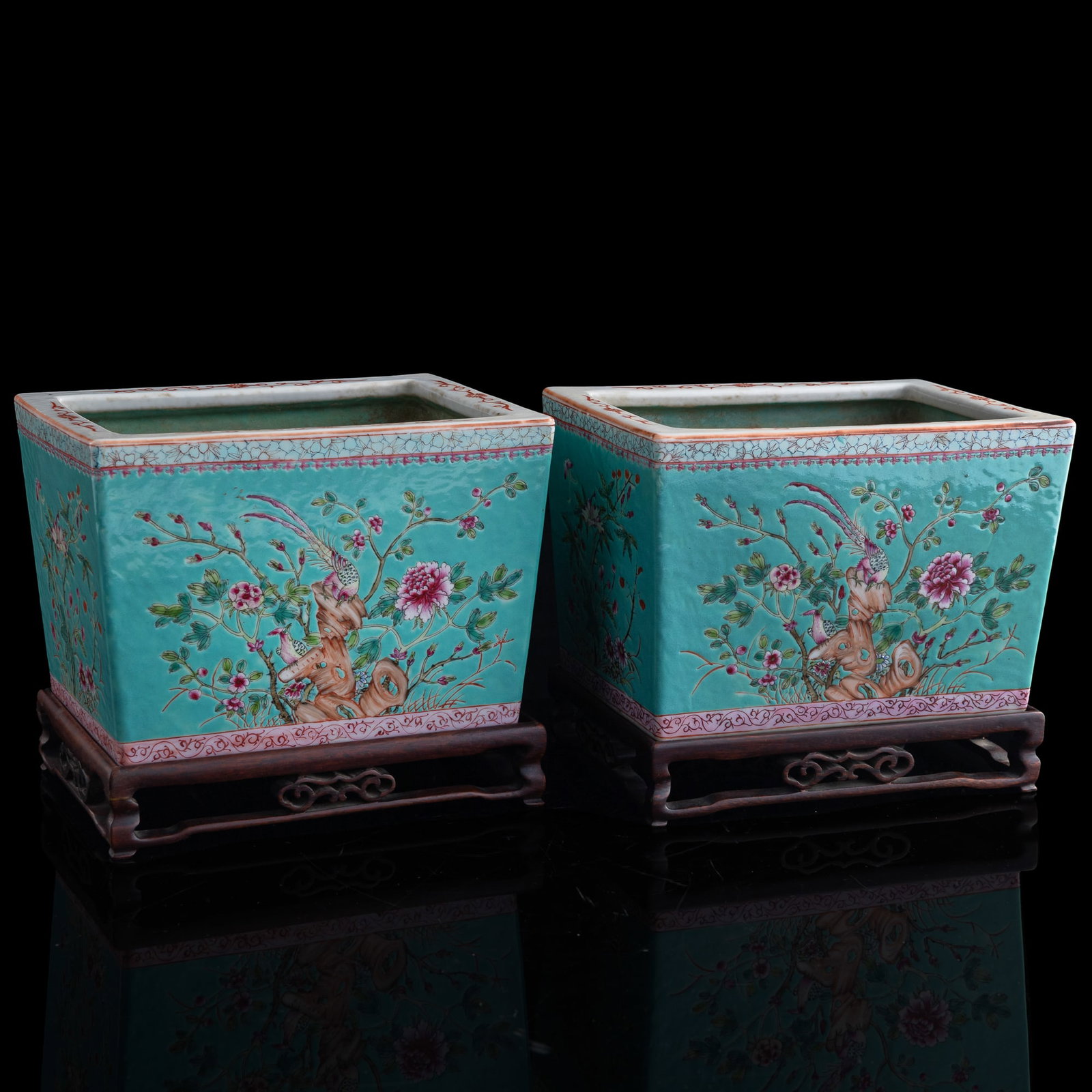 A pair of Chinese turquoise-ground famille rose planters, Republic period: A pair of Chinese turquoise-ground famille rose planters Republic period Each with six-character mark to underside. Sold with two associated wooden stands. (2). H: 6 1/8, W: 8 7/8, D: 6 3/8 in. (H: 15