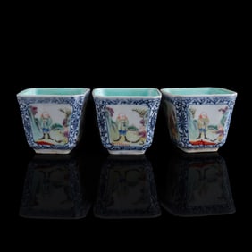 Three Chinese blue and famille rose cups, 19th century