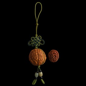 A Chinese walnut and an olive pit carving, Republic period