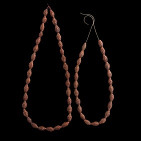Two strings of Chinese carved olive pit beads, Qing dynasty/Republic period