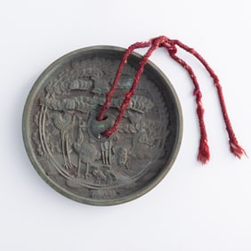 A Chinese bronze mirror, Ming dynasty or earlier