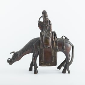 A Chinese bronze ornament of scholar riding donkey, 18th century