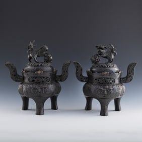 A pair of Chinese bronze 'lion'-finial censers, Qing dynasty