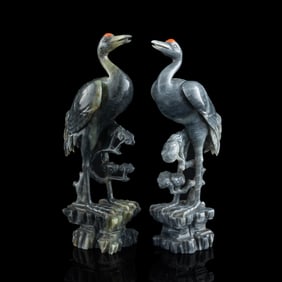 A pair of Chinese black and white jade cranes, 19th century