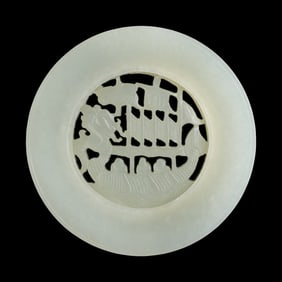A Chinese white jade pendant with rotating centerpiece, 19th century