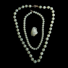 Two Chinese jade necklaces and a pendant