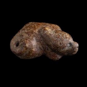 A Chinese jade toggle of a beast, Han dynasty or earlier