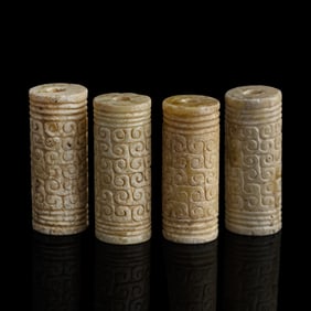 Four Chinese jade cylinders, Ming dynasty or earlier
