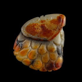 A Chinese russet jade pine cone-form pendant, 19th century