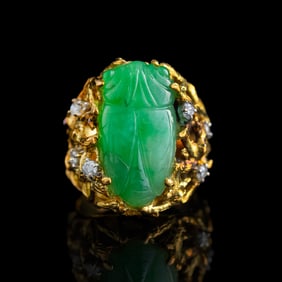 A Chinese gold-mounted jadeite 'cicada' and diamond ring