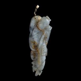 A Chinese carved jade reclining figure of a scholar, Ming dynasty