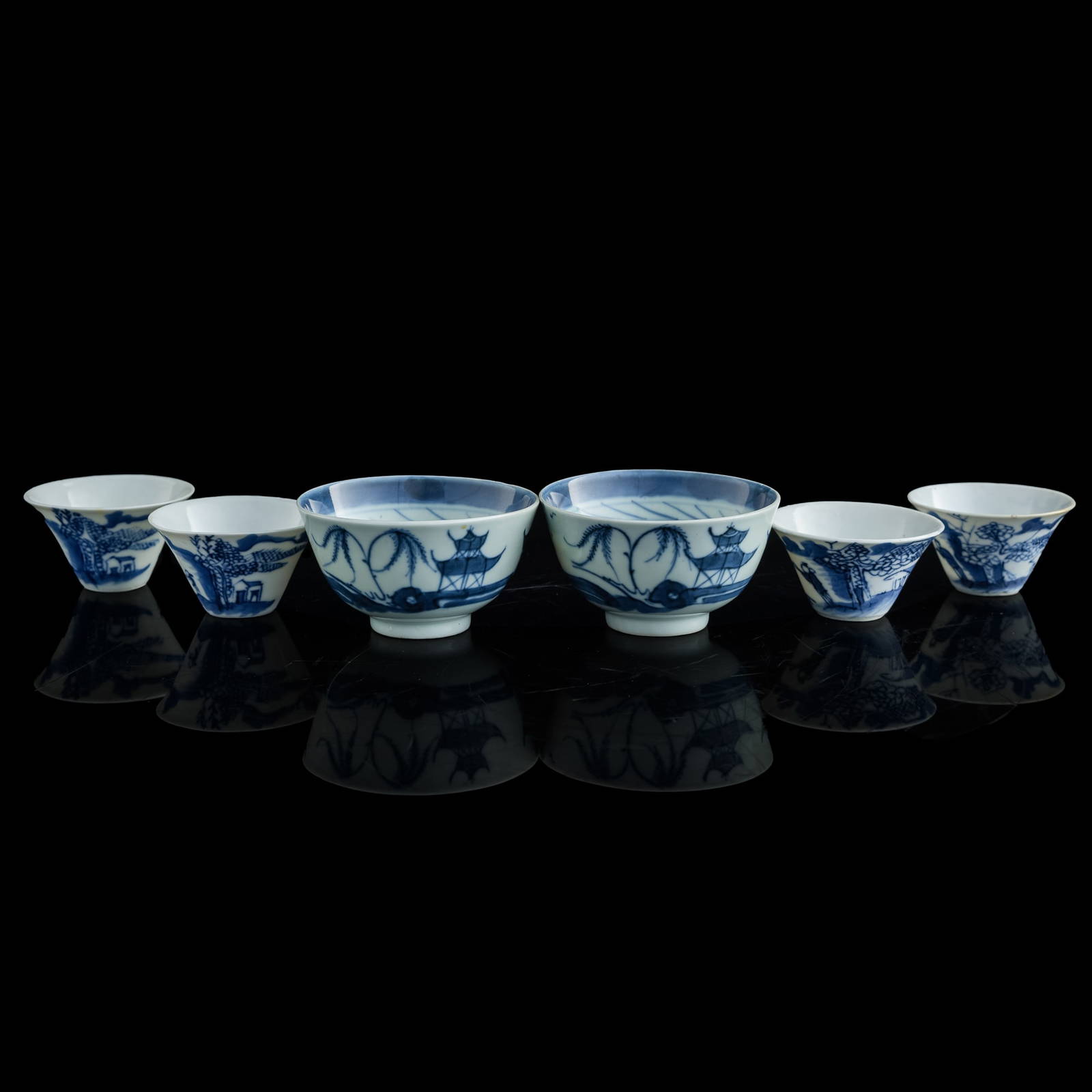 Six Chinese blue and white 'landscape' cups, late 19th century