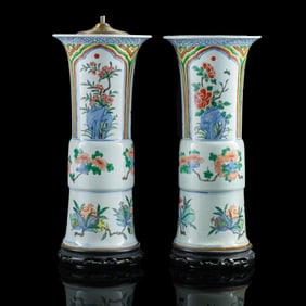 A pair of Chinese blue and enamel 'floral' gu vases, late 19th century