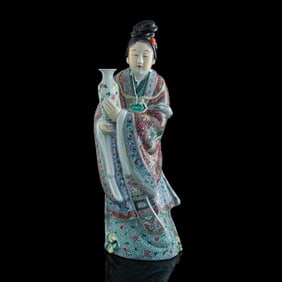 A Chinese famille rose court lady holding a vase, by Wan Tongshun, late 19th century