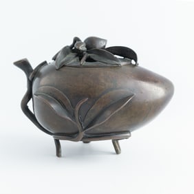 A Chinese bronze peach-form censer, 19th century