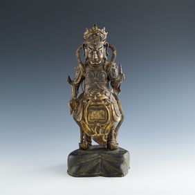 A Chinese gilt-bronze guardian figure, Ming dynasty