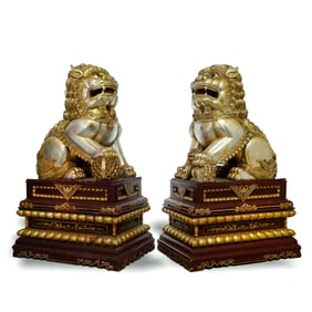 A pair of Chinese lacquered-wood guardian lions, late 19th century