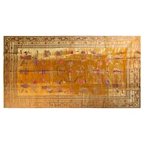 A Chinese yellow-ground rug with scholar's items, 18th/19th century