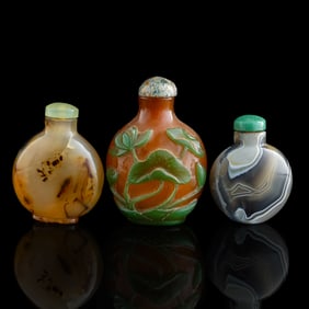 Two Chinese agate and a Peking glass snuff bottle, 19th century