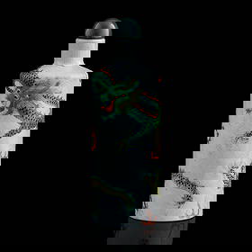 A Chinese famille rose 'dragon' snuff bottle, Republic period or later: A Chinese famille rose 'dragon' snuff bottle Republic period or later With four-character mark to underside. H: 3 3/8, Dia: 1 1/8 in. (H: 8.57, Dia: 2.86 cm.) Private collection, Rosedale, Maryland.