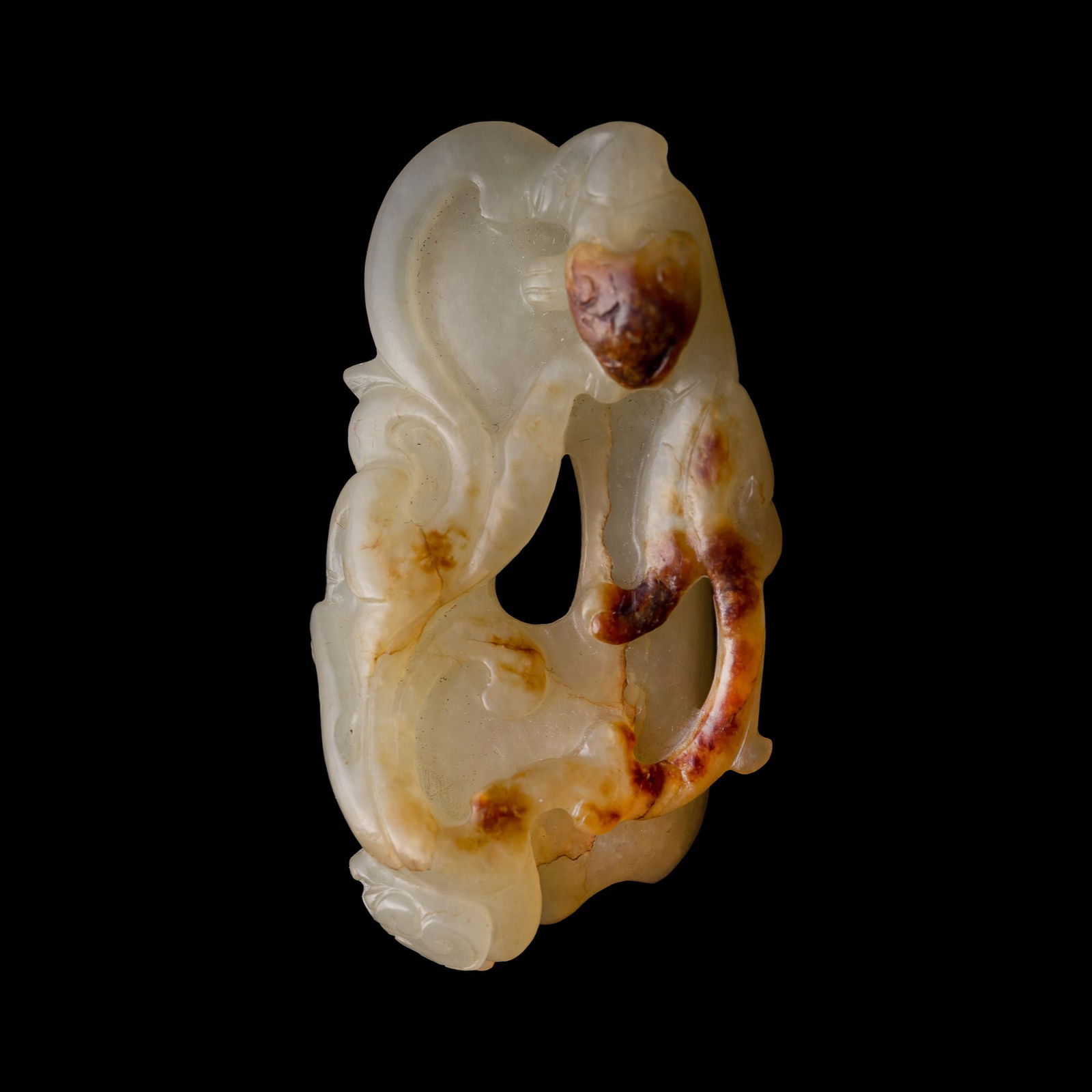 A Chinese white jade 'chilong' heart-shaped pendant, Ming dynasty (1 of 7)