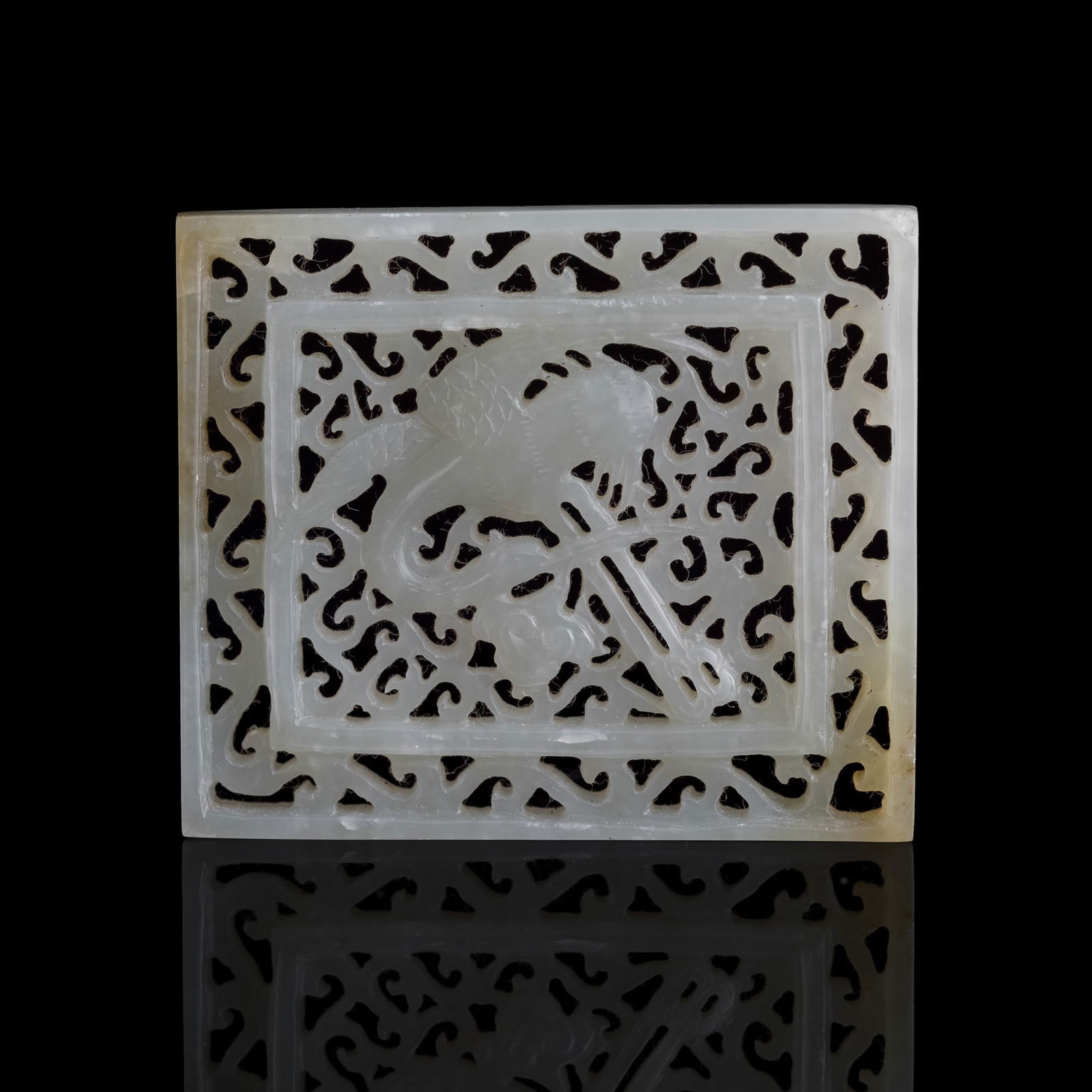 A Chinese reticulated white jade 'crane' belt plaque, Ming dynasty (1 of 6)