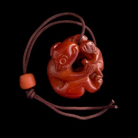 A Chinese amber 'monkey' pendant, 18th century
