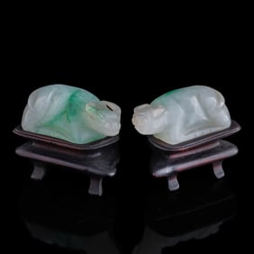 A pair of Chinese jadeite reclining oxen, 19th century