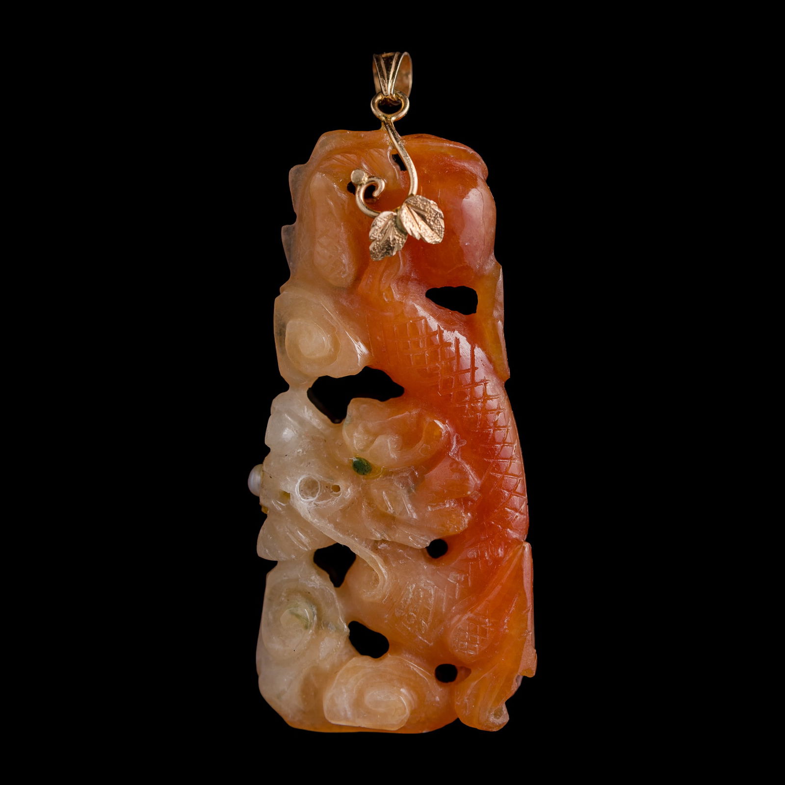 A Chinese red jadeite 'dragon' pendant (1 of 8)