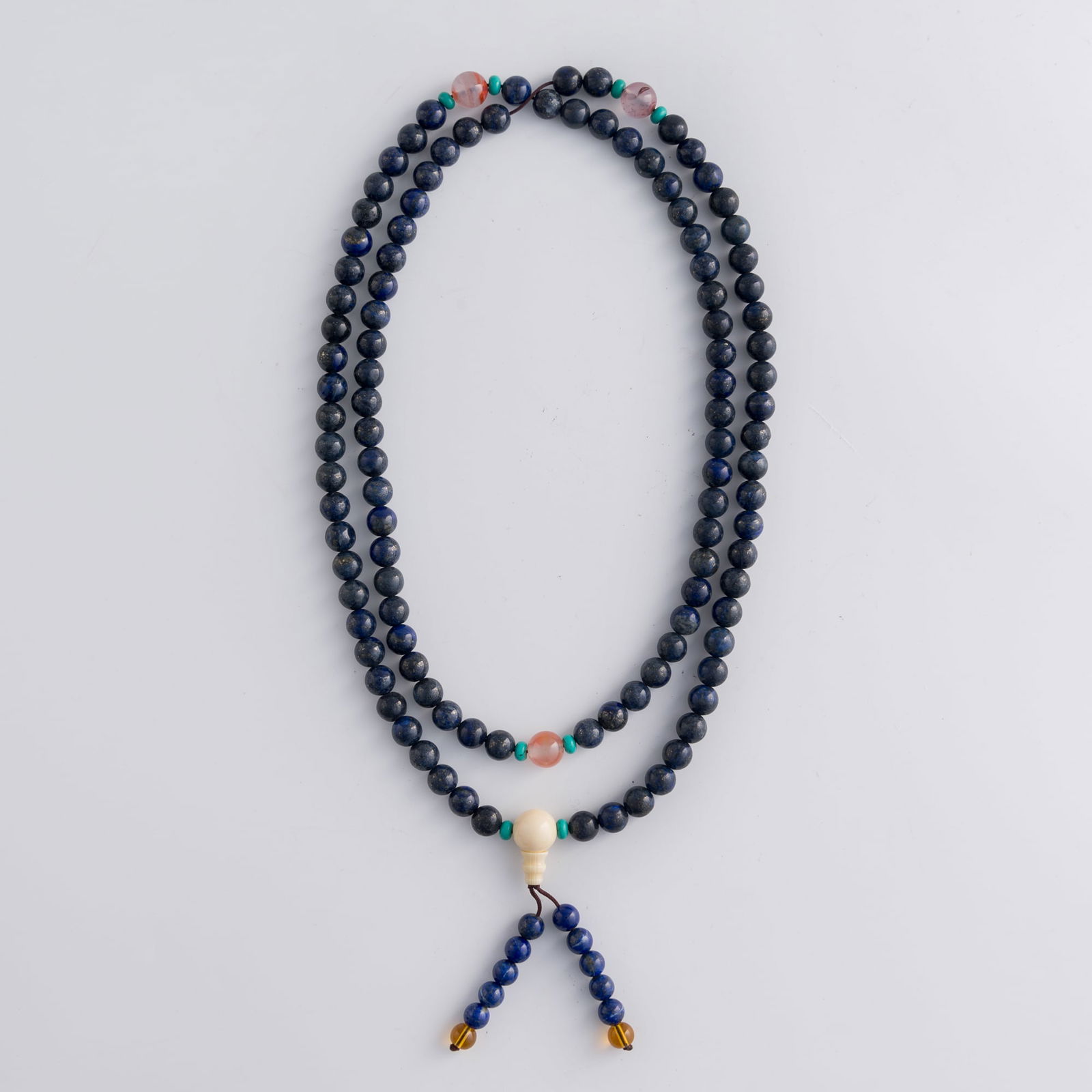 A strand of Chinese lapis beads: A strand of Chinese lapis beadsL: 24 1/4 in. (L: 61.6 cm.)Lapis bead diameter: 9.6 mm. (largest)Weight: 163.9 gPrivate collection, Mount Laurel, New Jersey. Click here for high resolution images. 