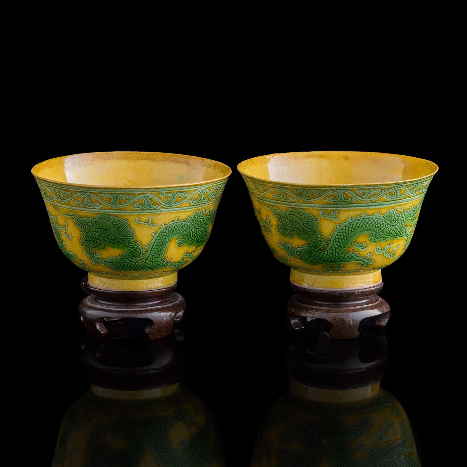 A pair of Chinese yellow-ground green enamel 'dragon' bowls, Qing dynasty (1 of 9)