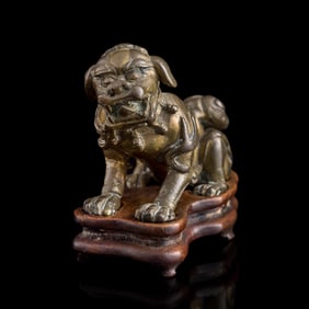 A Chinese copper-alloy lion, Ming dynasty or earlier