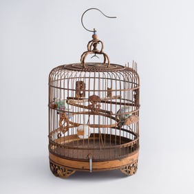 A Chinese carved bamboo bird cage