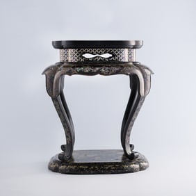 A Chinese black lacquer stand with mother-of-pearl inlay, early Qing dynasty