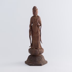 A Chinese iron figure of Guanyin, Ming dynasty or earlier
