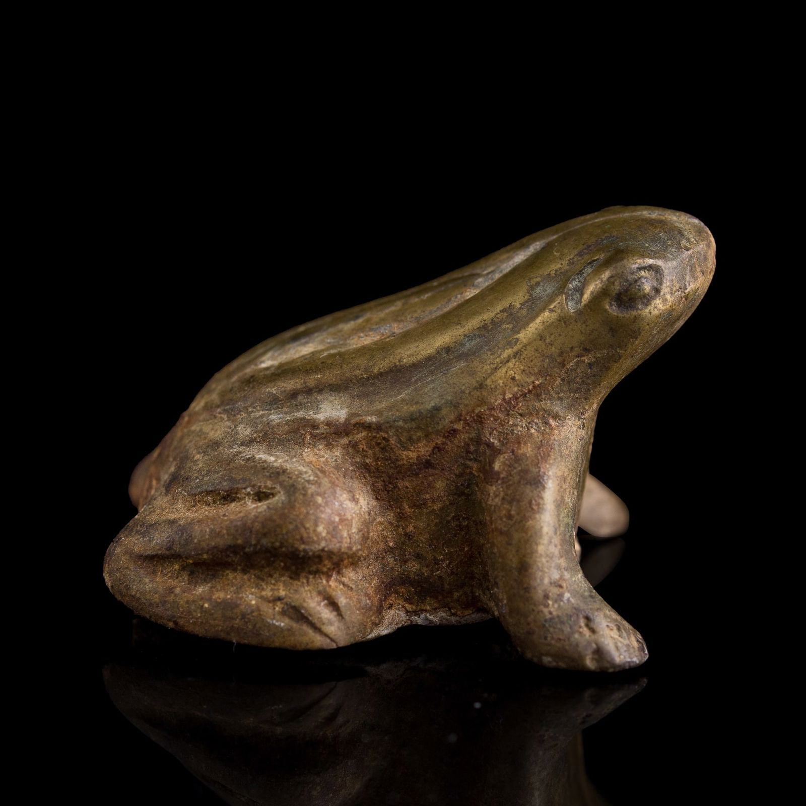 A Chinese gilt-bronze frog-form paperweight, Ming dynasty: A Chinese gilt-bronze frog-form paperweightMing dynastyH: 1 1/8, W: 1 5/8, D: 1 5/8 in. (H: 2.9, W: 4.1, D: 4.1 cm.)Weight: 99.78 gFrom Mrs. Schmidt of Council Bluffs, Iowa; inherited from her